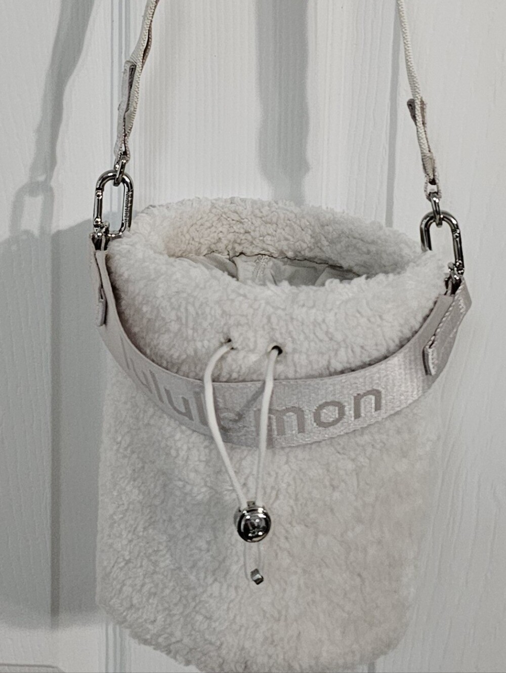 Lululemon Off White Shearling Crossbody Bucket Bag with Branded Strap
